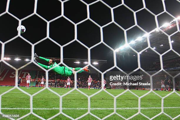 Asmir Begovic of Stoke City is beaten by a shot from Graziano Pelle of Southampton to concede the opening goal during the Capital One Cup Fourth...