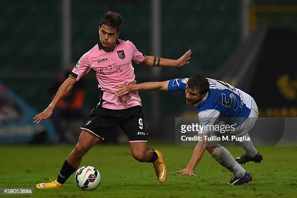 Paulo Dybala of Palermo and Perparim Hetemaj of Chievo compete for the ball during the Serie A match between US Citta di Palermo and AC Chievo Verona...