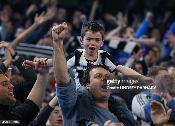 Newcastle United fans celebrate after their 2-0 win in the English League Cup fourth round football match between Manchester City and Newcastle...