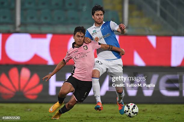 Paulo Dybala of Palermo and Ervin Zukanovic of Chievo compete for the ball during the Serie A match between US Citta di Palermo and AC Chievo Verona...