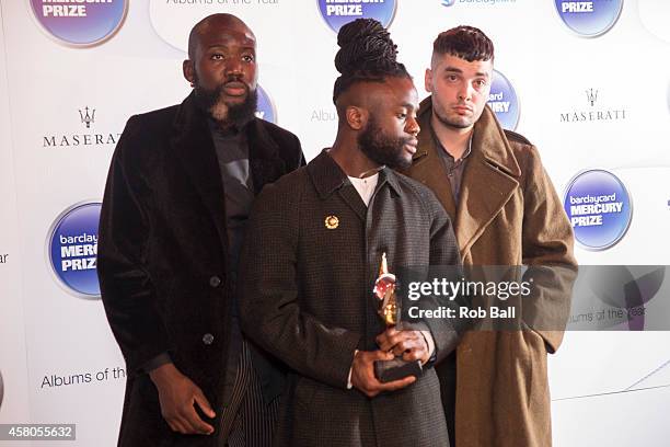 Alloysious Massaquoi, 'G' Hastings and Kayus Bankole of Young Fathers pose in the winner's room at the Barclaycard Mercury Prize at The Roundhouse on...