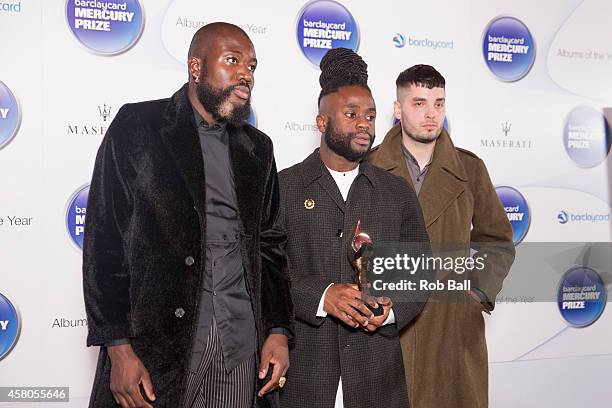 Alloysious Massaquoi, 'G' Hastings and Kayus Bankole of Young Fathers pose in the winner's room at the Barclaycard Mercury Prize at The Roundhouse on...