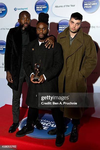 Alloysious Massaquoi, 'G' Hastings and Kayus Bankole of Young Fathers pose in the winners room at the Barclaycard Mercury Prize at The Roundhouse on...