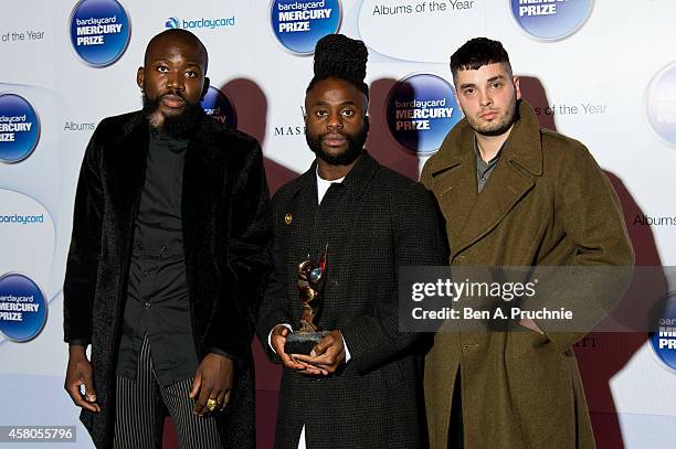 Alloysious Massaquoi, 'G' Hastings and Kayus Bankole of Young Fathers pose in the winners room at the Barclaycard Mercury Prize at The Roundhouse on...