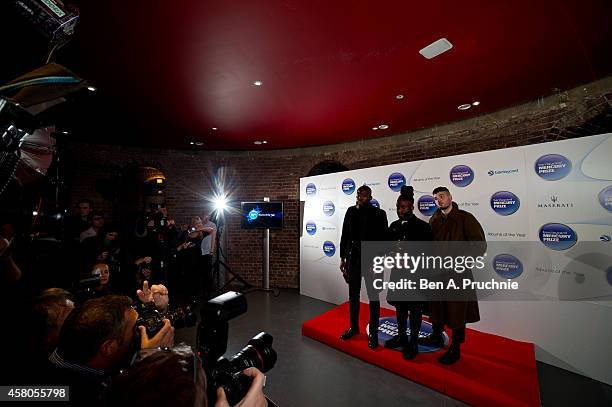 Alloysious Massaquoi, 'G' Hastings and Kayus Bankole of Young Fathers pose in the winners room at the Barclaycard Mercury Prize at The Roundhouse on...