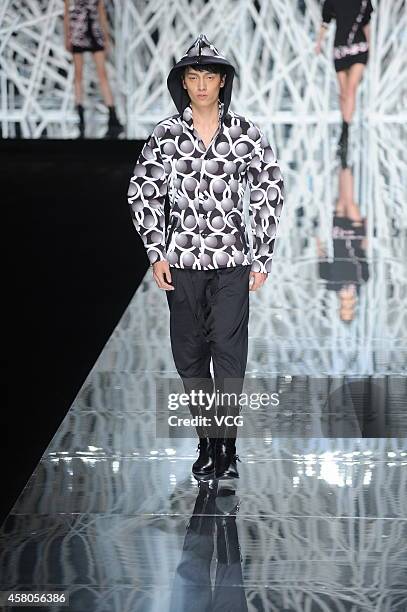 Model showcases designs on the runway at GIOIA PAN Collection show during the fourth day of the Mercedes-Benz China Fashion Week Spring/Summer 2015...