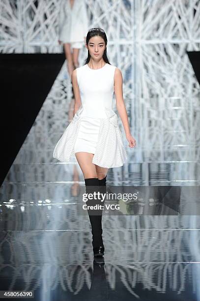 Model showcases designs on the runway at GIOIA PAN Collection show during the fourth day of the Mercedes-Benz China Fashion Week Spring/Summer 2015...