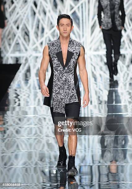 Model showcases designs on the runway at GIOIA PAN Collection show during the fourth day of the Mercedes-Benz China Fashion Week Spring/Summer 2015...