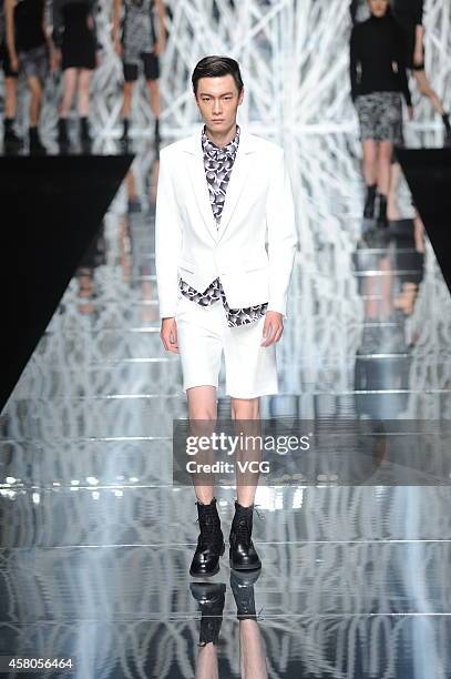 Model showcases designs on the runway at GIOIA PAN Collection show during the fourth day of the Mercedes-Benz China Fashion Week Spring/Summer 2015...