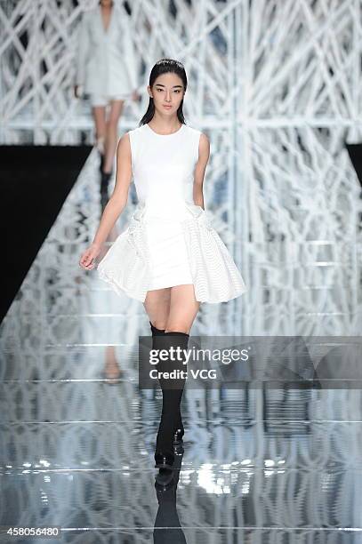 Model showcases designs on the runway at GIOIA PAN Collection show during the fourth day of the Mercedes-Benz China Fashion Week Spring/Summer 2015...