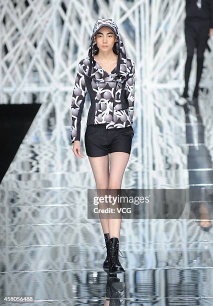 Model showcases designs on the runway at GIOIA PAN Collection show during the fourth day of the Mercedes-Benz China Fashion Week Spring/Summer 2015...