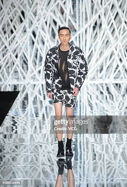 Model showcases designs on the runway at GIOIA PAN Collection show during the fourth day of the Mercedes-Benz China Fashion Week Spring/Summer 2015...