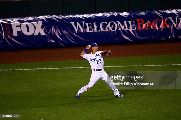 Norichika Aoki of the Kansas City Royals throws a ball to third base in the fourth inning against the San Francisco Giants during Game Seven of the...