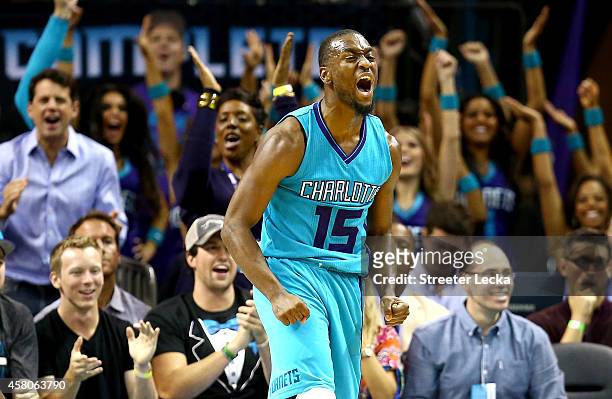 Kemba Walker of the Charlotte Hornets reacts after making a shot against the Milwaukee Bucks during their game at Time Warner Cable Arena on October...