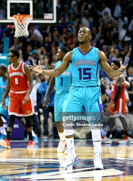 Kemba Walker of the Charlotte Hornets reacts after hitting a game tieing shot late in the fourth quarter against the Milwaukee Bucks during their...