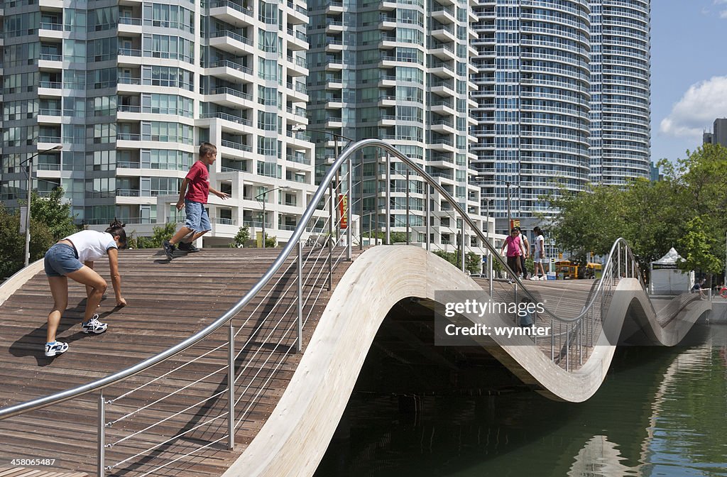 Children Play on Wavedeck at Toronto's Harbourfront Centre in Summer