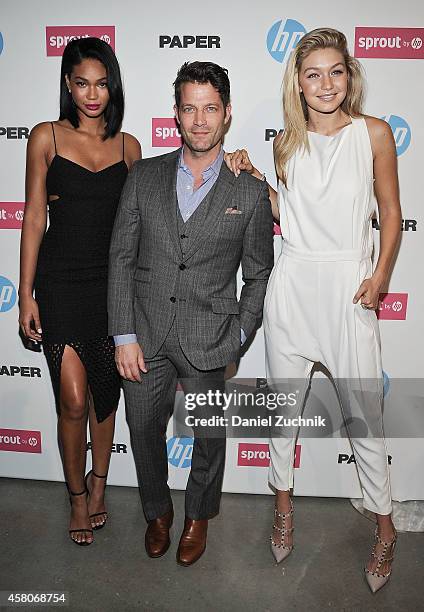 Models Chanel Iman and Gigi Hadid with interior designer Nate Berkus attend the Paper Magazine New Technology Launch at Center 545 on October 29,...