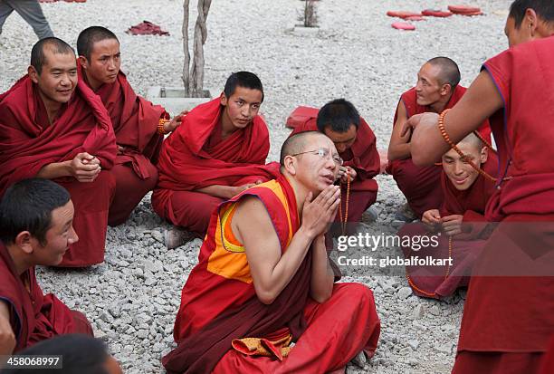 monks in debate sera monastery lhasa tibet - tibetan culture stock pictures, royalty-free photos & images
