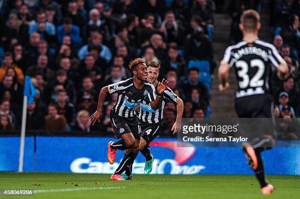 Rolando Aarons celebrates after scoring the opening goal during the Capital One Cup Fourth Round match between Manchester City and Newcastle United...