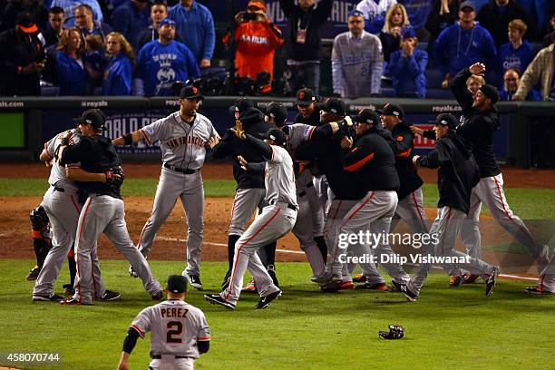 The San Francisco Giants celebrate after defeating the Kansas City Royals to win Game Seven of the 2014 World Series by a score of 3-2 at Kauffman...