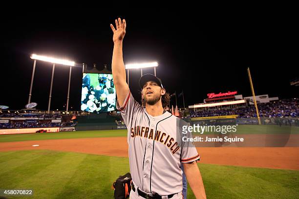 Madison Bumgarner of the San Francisco Giants acknowledges the crowd after defeating the Kansas City Royals to win Game Seven of the 2014 World...