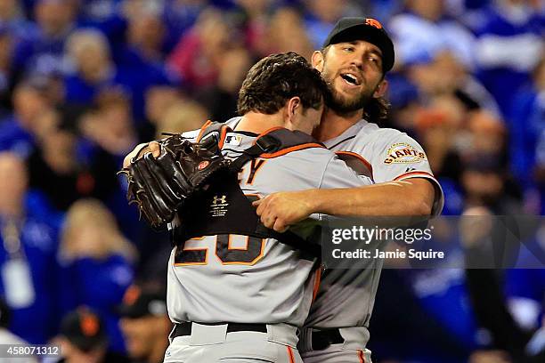 Buster Posey and Madison Bumgarner of the San Francisco Giants celebrate after defeating the Kansas City Royals to win Game Seven of the 2014 World...