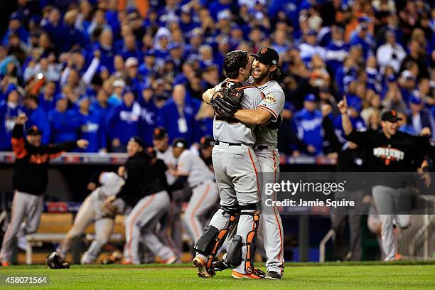 Buster Posey and Madison Bumgarner of the San Francisco Giants celebrate after defeating the Kansas City Royals to win Game Seven of the 2014 World...