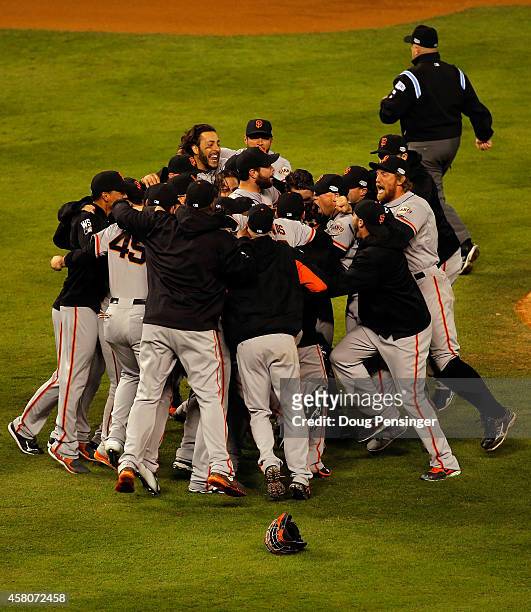 The San Francisco Giants celebrate after defeating the Kansas City Royals to win Game Seven of the 2014 World Series by a score of 3-2 at Kauffman...