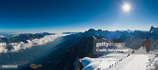 mountaineers climbing above the clouds alps panorama - blanche vallee stock pictures, royalty-free photos & images