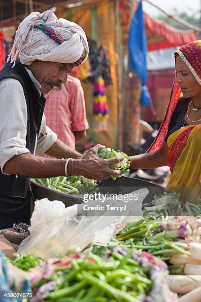 camel fair - vendor selling pulses in local market stock pictures, royalty-free photos & images