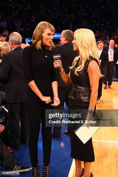 Musician Taylor Swift is interviewed by reporter Jill Martin during a game between the New York Knicks and the Chicago Bulls at Madison Square Garden...