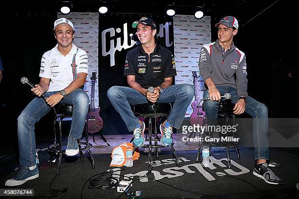 Felipe Massa, Sergio "Checo" Perez and Esteban Gutierez participate in the F1 Fan's Forum at Gibson Austin Showroom on October 29, 2014 in Austin,...