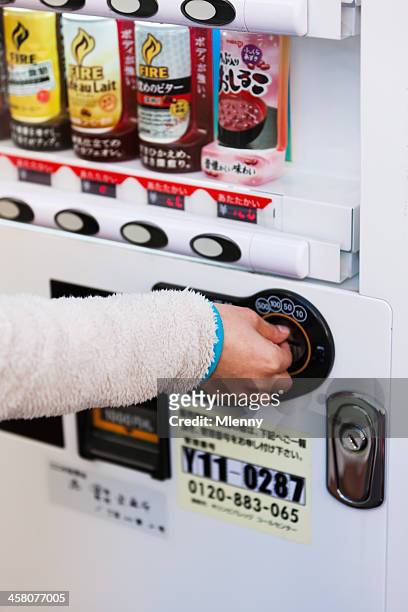 buying drink from vending machine tokyo japan - teen pokies stock pictures, royalty-free photos & images