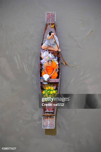 monk on the river - floating markets bangkok stock pictures, royalty-free photos & images