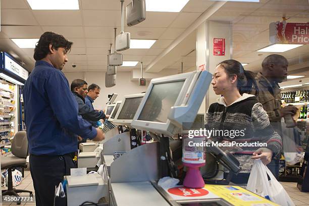 supermarket shopping - tesco stock pictures, royalty-free photos & images
