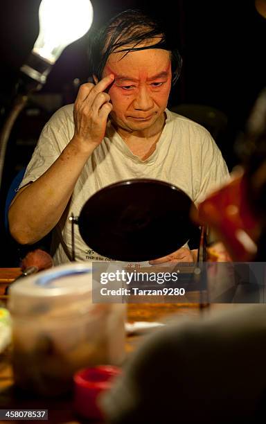 actors making up at back stage - peking opera stock pictures, royalty-free photos & images