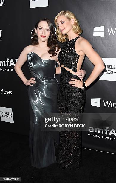 Actresses Beth Behrs and Kat Dennings attend amfARs fifth annual Inspiration Gala in Los Angeles, October 29, 2014 at Milk Studios in Hollywood,...