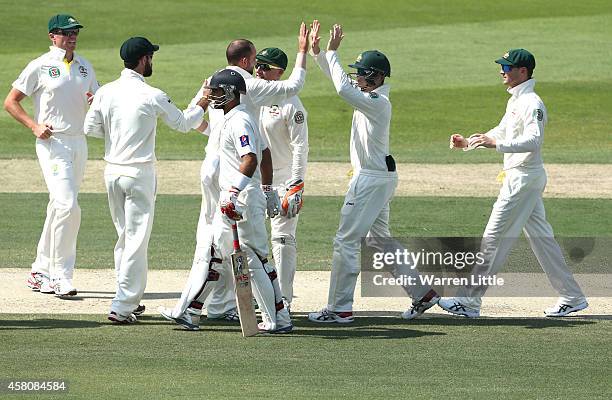 Nathan Lyon of Australia is congratulated after bowling Ahmed Shehzad of Pakistan lbw during day one of the second test between Pakistan and...