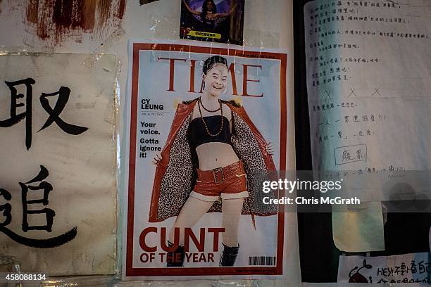 Poster showing Hong Kong's Chief Executive C.Y. Leung is seen on a wall at the Occupy Central protest site in the Admiralty District on October 29,...