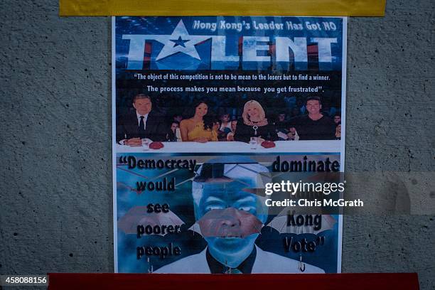 Poster showing Hong Kong's Chief Executive C.Y. Leung is seen on a wall at the Occupy Central protest site in the Admiralty District on October 29,...