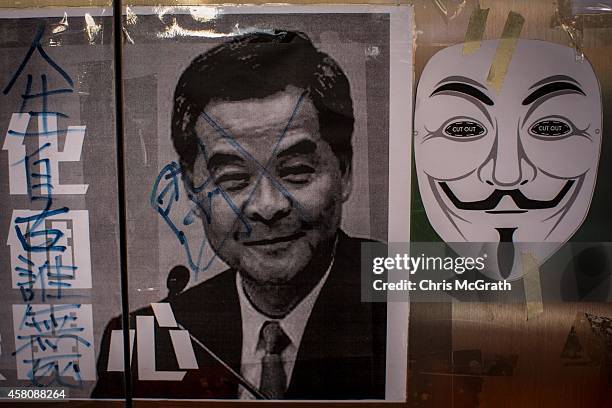 Poster showing Hong Kong's Chief Executive C.Y. Leung is seen on a wall at the Occupy Central protest site in the Admiralty District on October 29,...