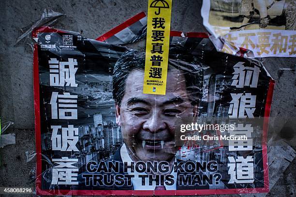 Poster showing Hong Kong's Chief Executive C.Y. Leung is seen on a wall at the Occupy Central protest site in the Admiralty District on October 29,...