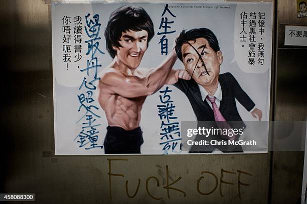 Poster showing Hong Kong's Chief Executive C.Y. Leung is seen on a wall at the Occupy Central protest site in the Admiralty District on October 29,...