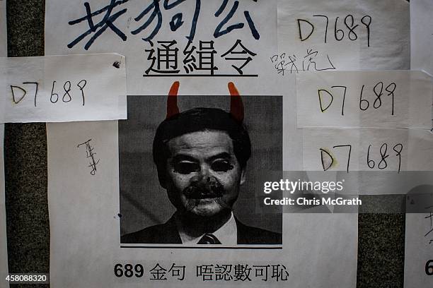 Poster showing Hong Kong's Chief Executive C.Y. Leung is seen on a wall at the Occupy Central protest site in the Admiralty District on October 29,...