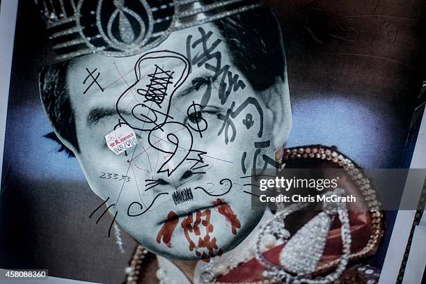 Poster showing Hong Kong's Chief Executive C.Y. Leung is seen on a wall at the Occupy Central protest site in the Admiralty District on October 29,...