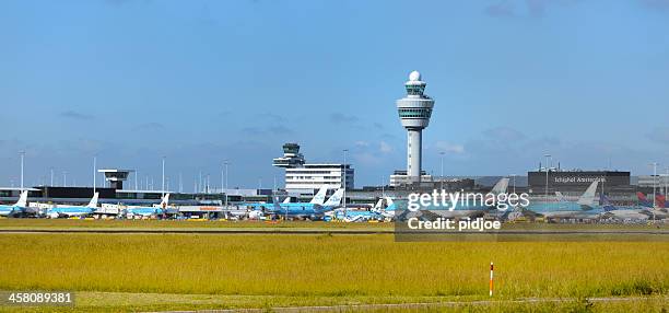 airplanes at amsterdam airport schiphol - amsterdam airport stock pictures, royalty-free photos & images