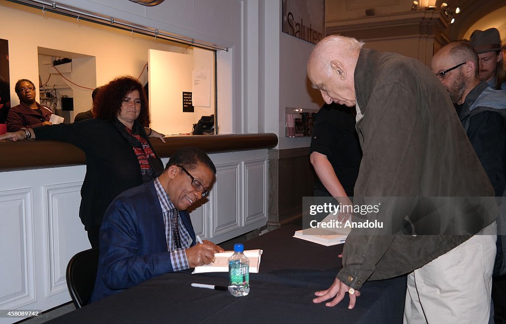 Herbie Hancock autographs his book in New York