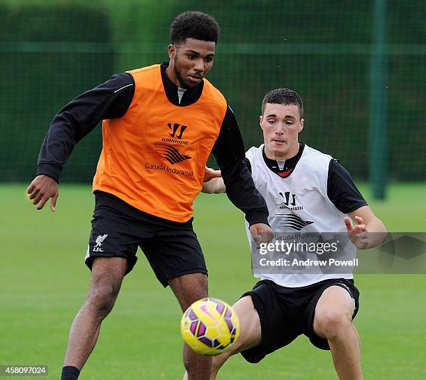 Jerome Sinclair and Lloyd Jones of Liverpool in action during a training session at Melwood Training Ground on October 30, 2014 in Liverpool, England.