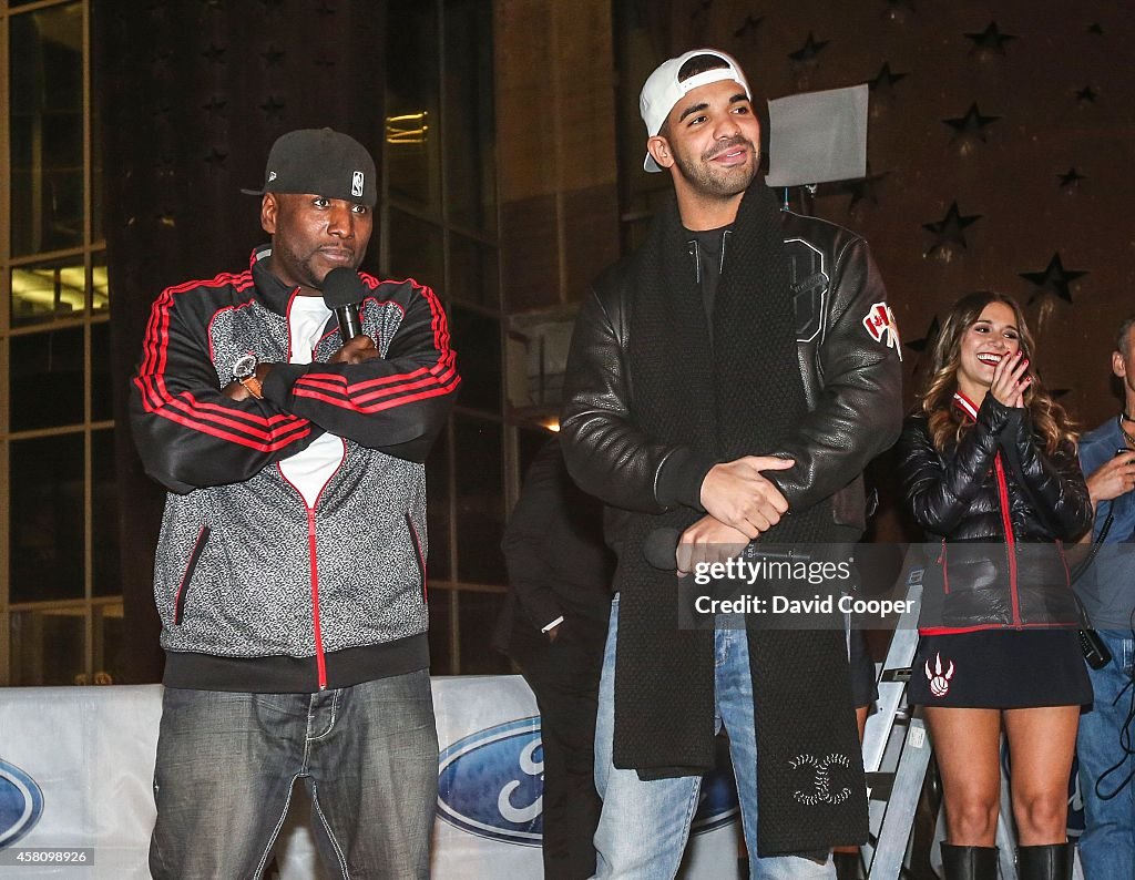 Drake greets the fans outside as Raptors faithful celebrate the first game of the season