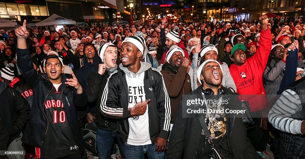 Raptors fans celebrate the first game of the season